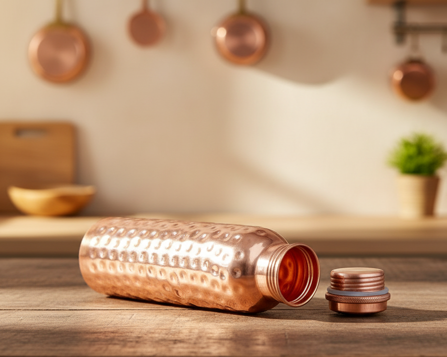 Copper water bottle with open screw lid showing pure copper interior food grade