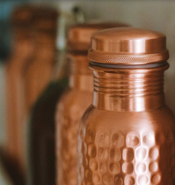 Hammered texture detail of handcrafted copper water bottle premium finish