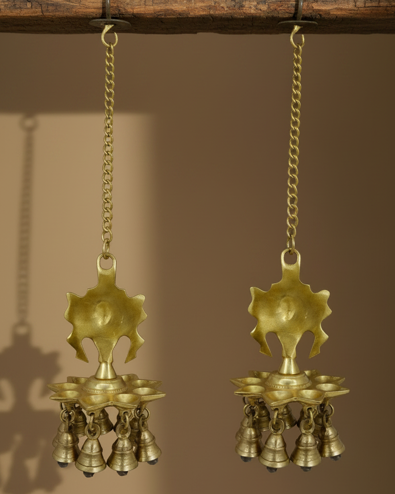 Handcrafted brass Shankh Chakra hanging diya with traditional bells