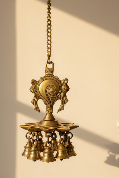 Handcrafted brass Shankh Chakra hanging diya with traditional bells